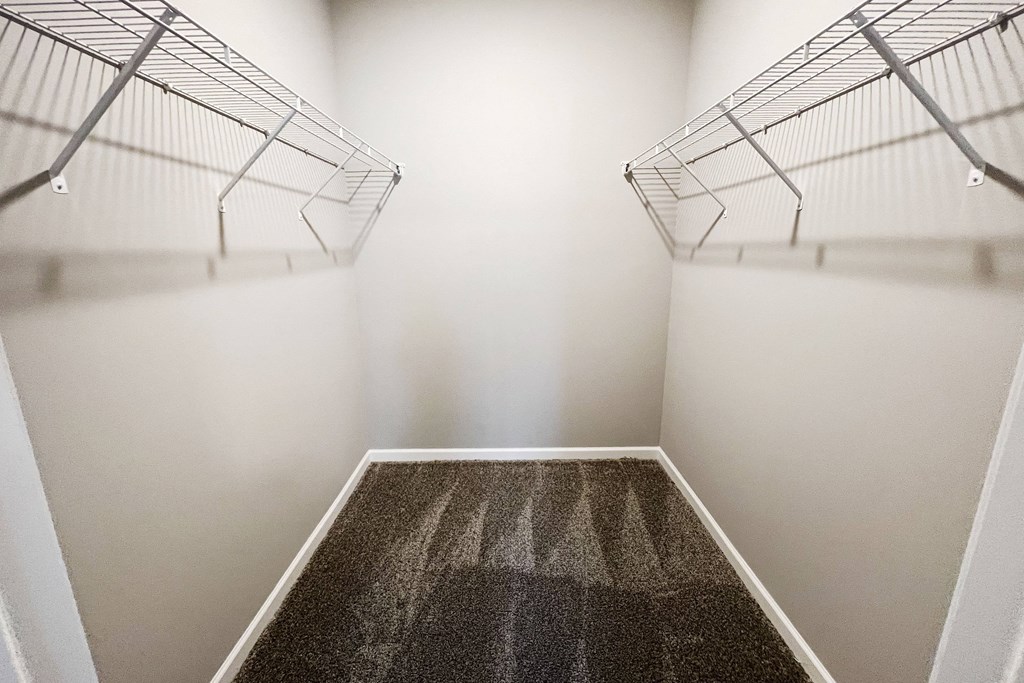 a spacious room with two closets and a carpeted floor  at Brookfield Village Apartments, Ohio