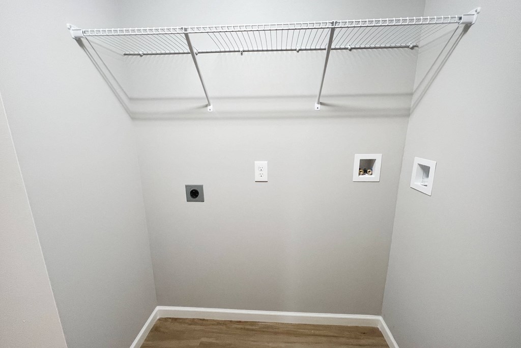 a room with white walls and a ceiling with pictures on it  at Brookfield Village Apartments, Grove City
