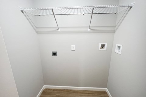 a room with white walls and a ceiling with pictures on it  at Brookfield Village Apartments, Grove City