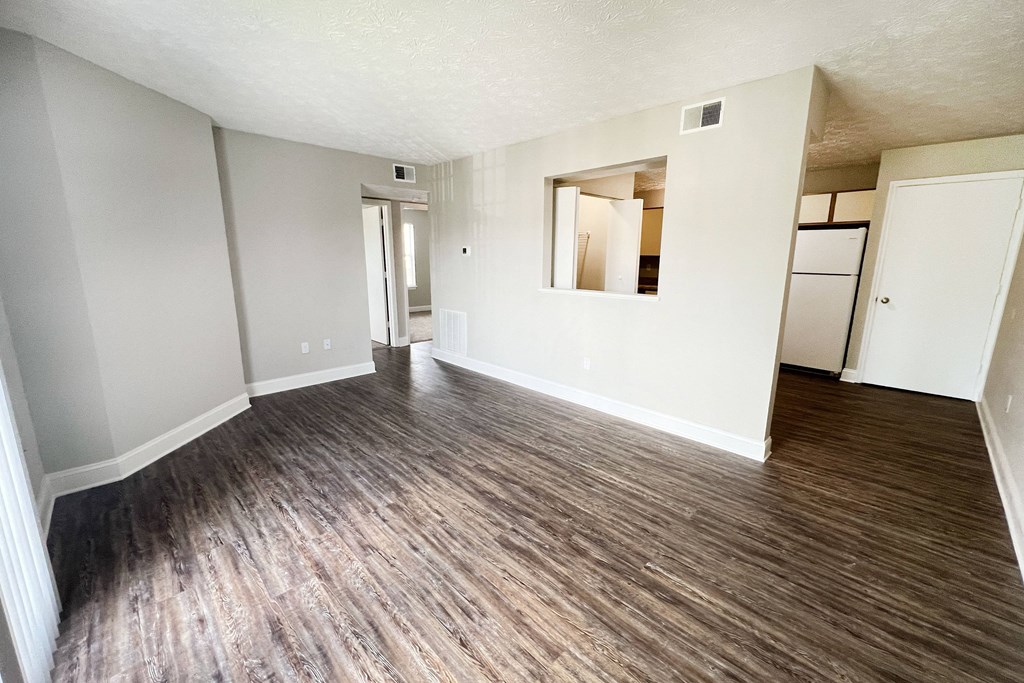 living room with white walls and wood flooring at 450 on Keeneland Apartments, Kentucky