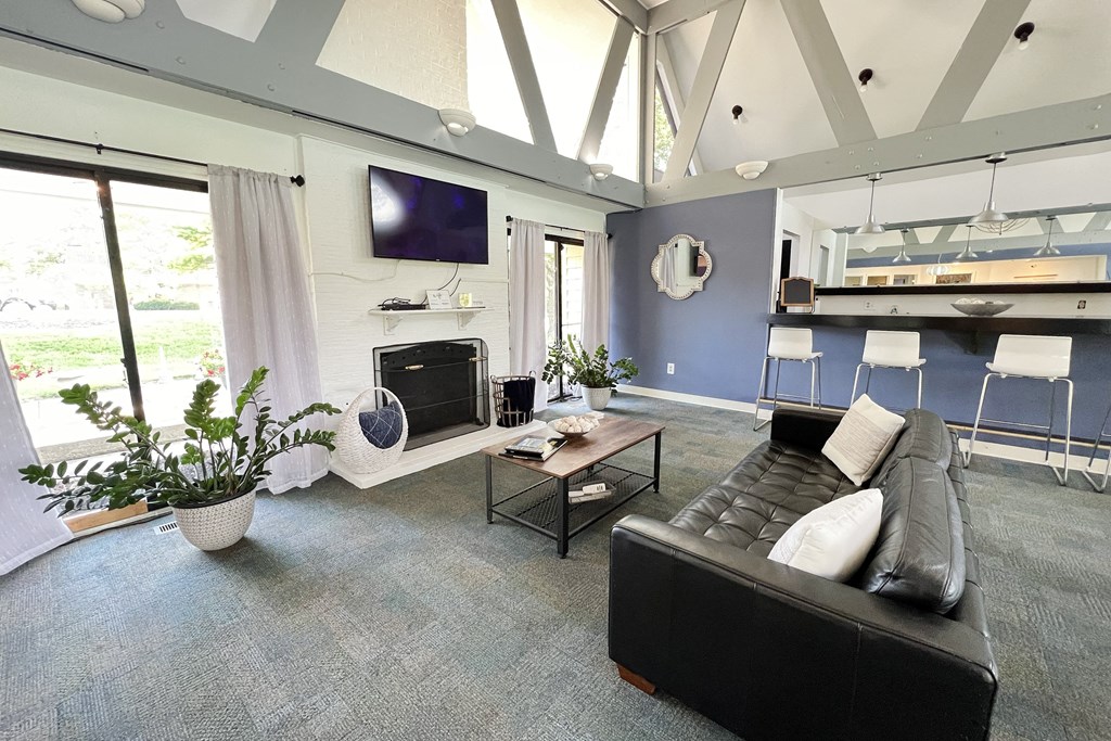 a living room with a black leather couch and a television at Miamisburg by the Mall, Miamisburg, OH, 45342