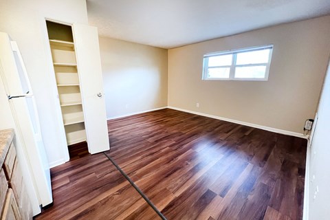 A room with wooden floors and a window at Crown Crossing Apartments, Amelia, OH, 45102