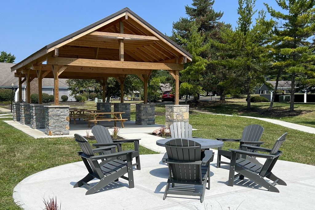 a patio with tables and chairs in front of a pavilion at Deercross Apartments, Ohio, 45236