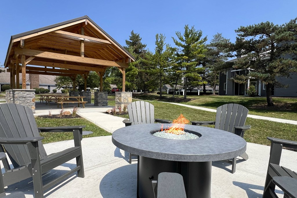 a patio with a fire pit and chairs around it at Deercross Apartments, Ohio, 45236