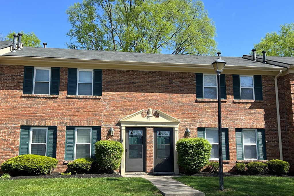 the front of a brick house with a front doorat Revere Village Apartments, Centerville, Ohio