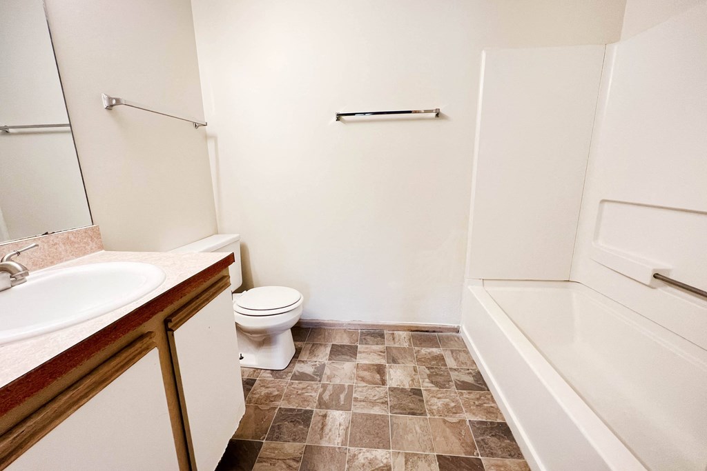 a bathroom with a sink toilet and a bath tub at Eagle Crest Apartments, Ohio