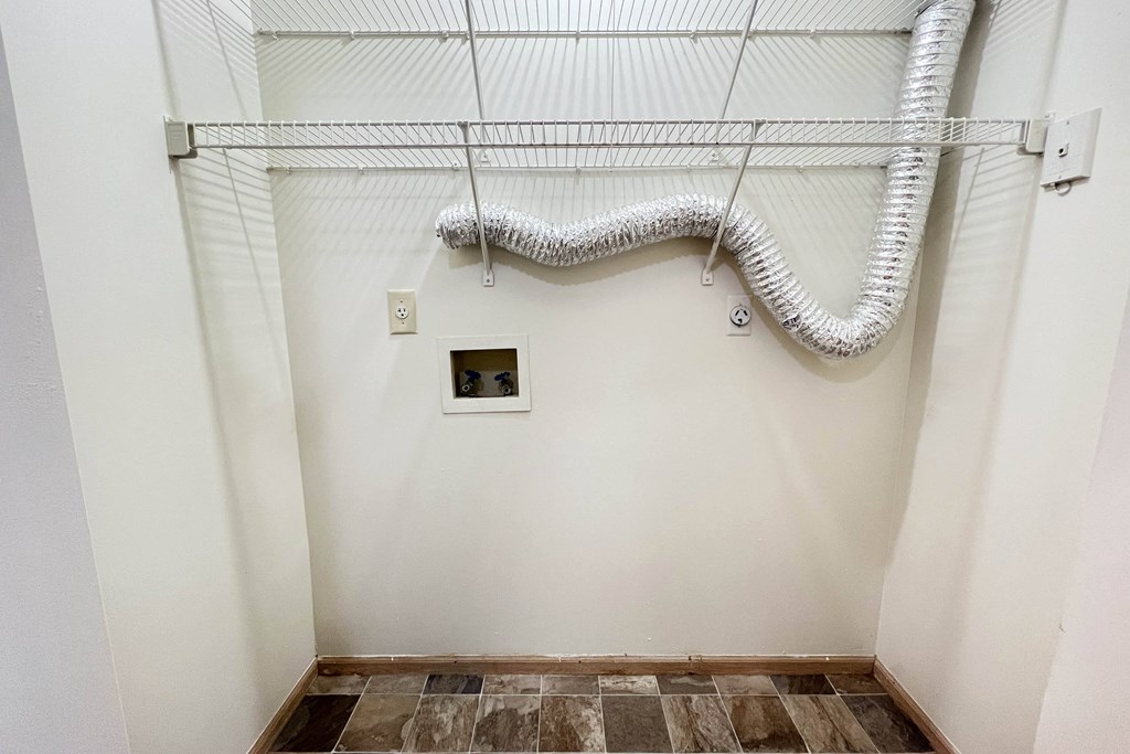 an empty bathroom with white walls and wires on the ceiling at Eagle Crest Apartments, Galloway