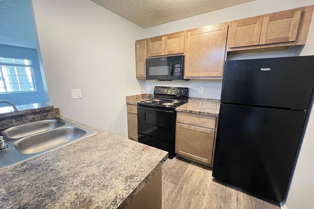 a kitchen with stainless steel appliances and granite counter tops at Eagle Crest Apartments, Ohio, 43119