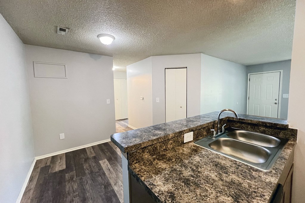 the spacious kitchen with granite countertops and stainless steel sink at Eagle Crest Apartments, Galloway