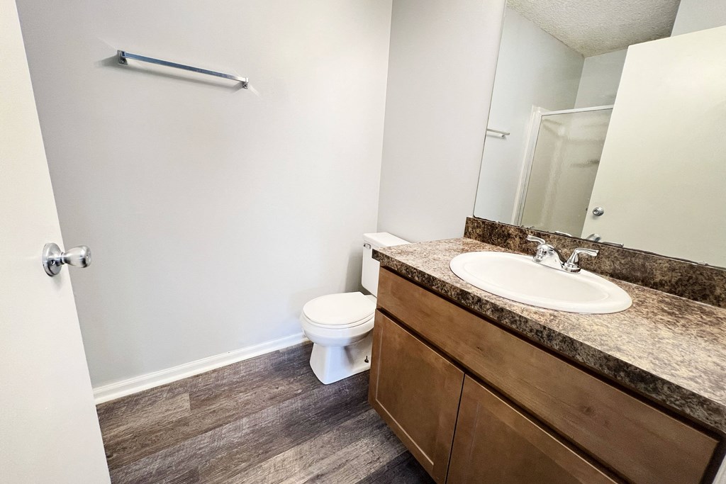 an empty bathroom with a sink and a toilet at Eagle Crest Apartments, Galloway