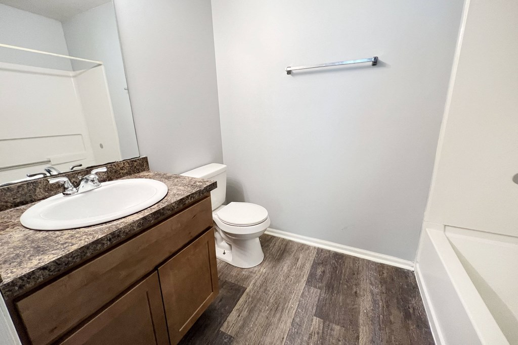 an empty bathroom with a sink and a toilet at Eagle Crest Apartments, Galloway, OH