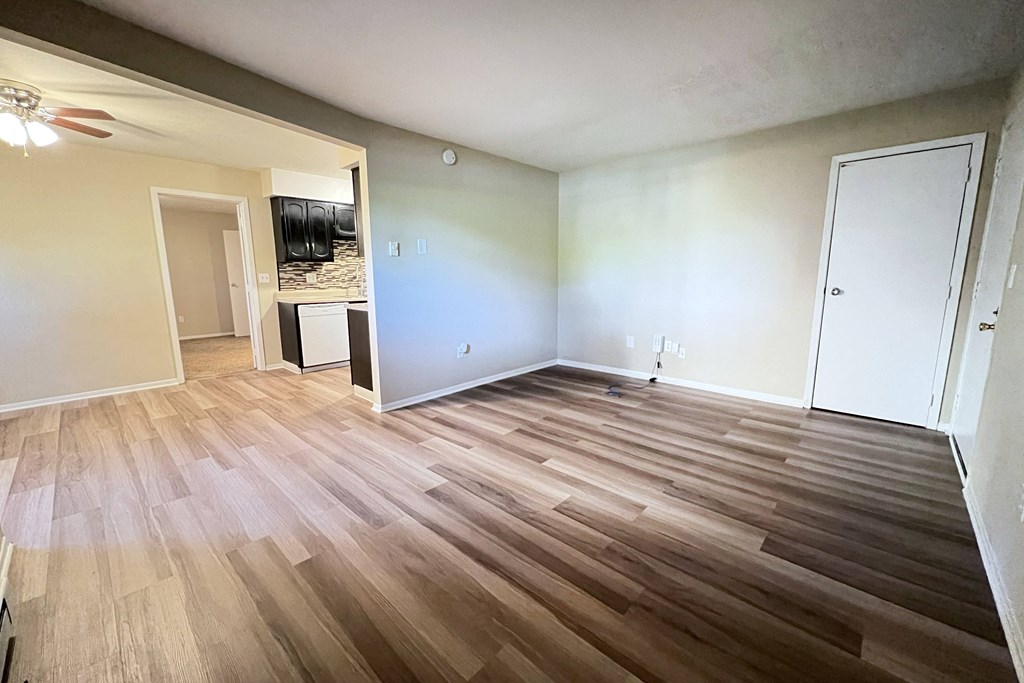 an empty living room with wood flooring at Hunter Ridge Apartments, Cincinnati