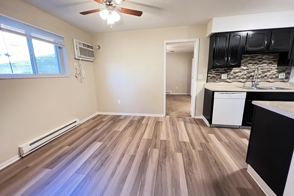 an empty kitchen with wood flooring and a window at Hunter Ridge Apartments, Cincinnati, OH, 45244