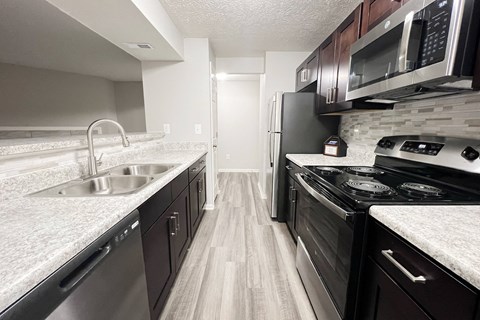 full kitchen with stainless steel appliances at the reserve at walnut creek apartments at The Vinings Apartments, Ohio, 45245