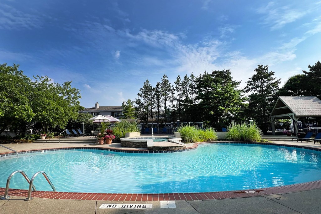 a swimming pool at the resort on a sunny day at Deercross Apartments, Cincinnati, OH