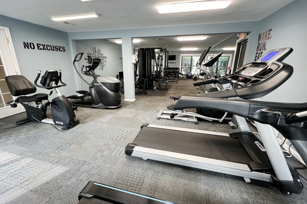 a gym with treadmills and other exercise equipment  at Deercross Apartments, Ohio