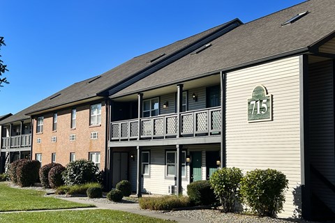 Apartment building with the number 715 on the front.
