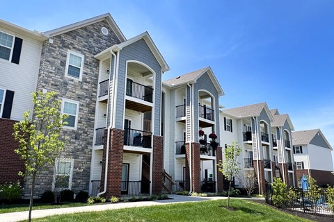 a row of apartment buildings with brick and stone exterior  at Parkway Trails, Florence, KY, 41042