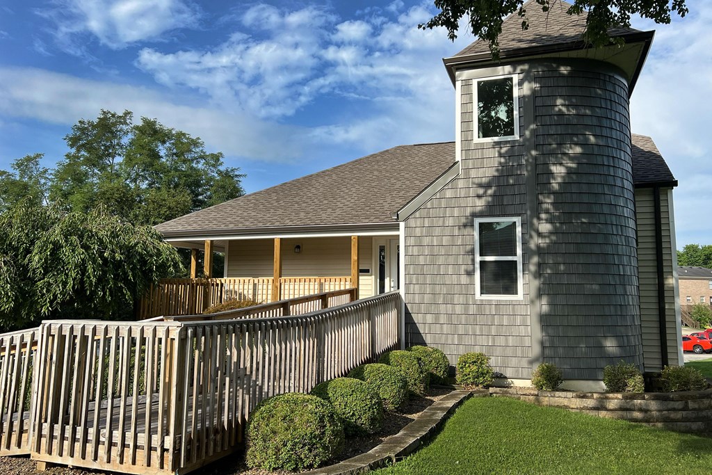 a house with a fence in front of it at 450 on Keeneland Apartments, Richmond, Kentucky