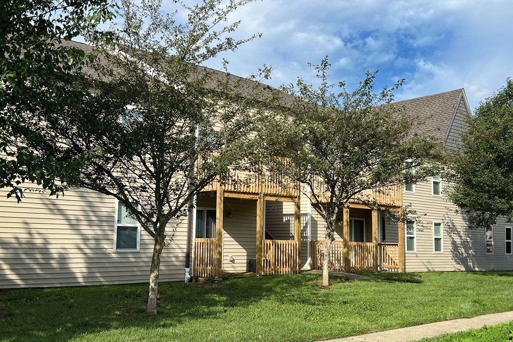 the exterior of a house with trees in front of it at 450 on Keeneland Apartments, Kentucky