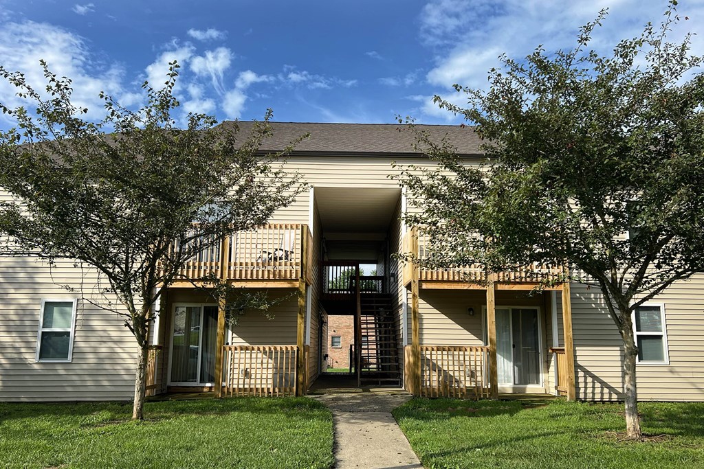 an apartment building with trees and a sidewalk at 450 on Keeneland Apartments, Richmond, 40475