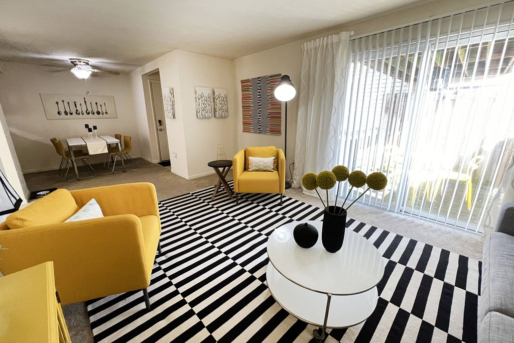 a living room with yellow furniture and a black and white rug at Miamisburg by the Mall, Miamisburg, OH, 45342