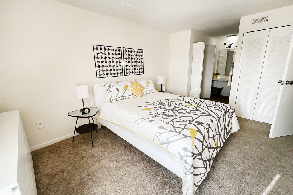 a bedroom with a large bed and carpeted floor at Miamisburg by the Mall, Miamisburg, 45342