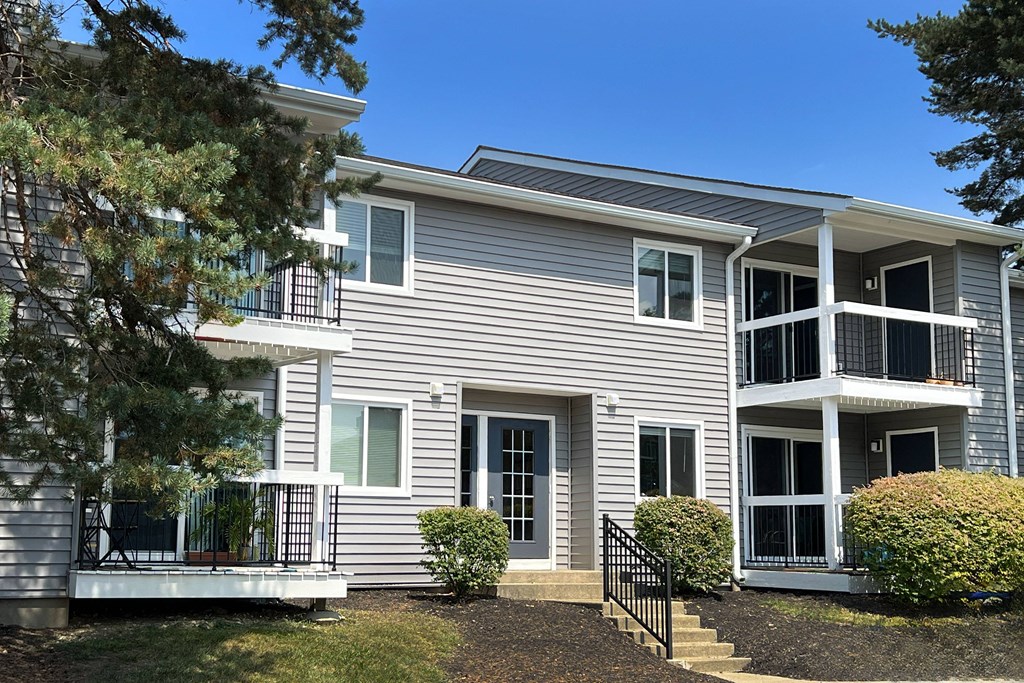 a white house with a tree at Deercross Apartments, Cincinnati
