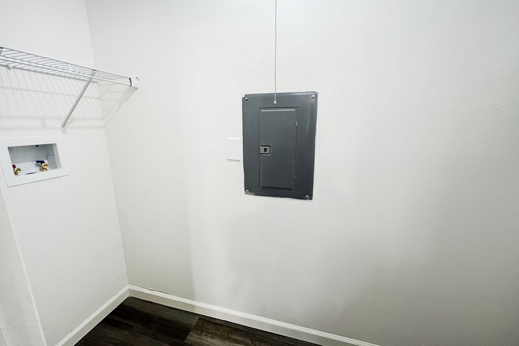 a black door on a white wall in a room at Deercross Apartments, Cincinnati