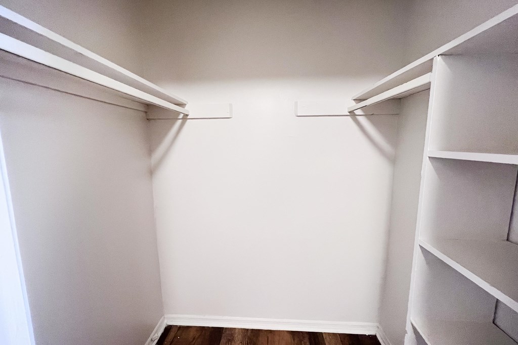Empty white shelves in a room.