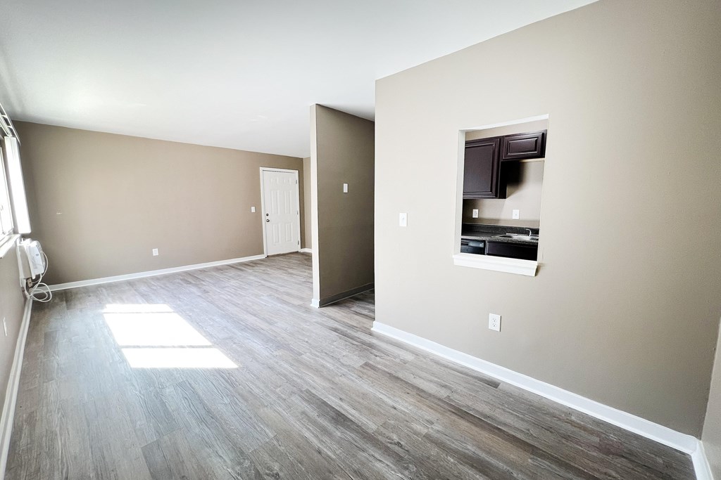 A room with a door and a window.