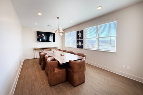 Dining room with modern chandelier and large windows at The Meridian on 32 Apartments, Ohio, 45103