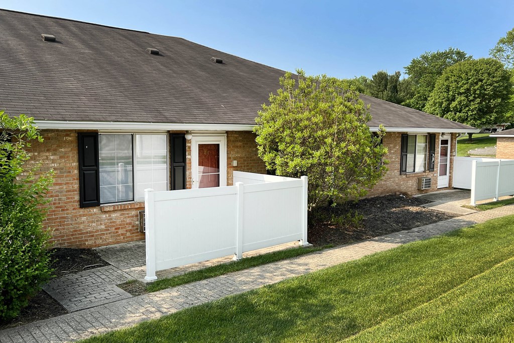a house with a white fence in front of it  at Wyndemere Apartments, Ohio, 45005
