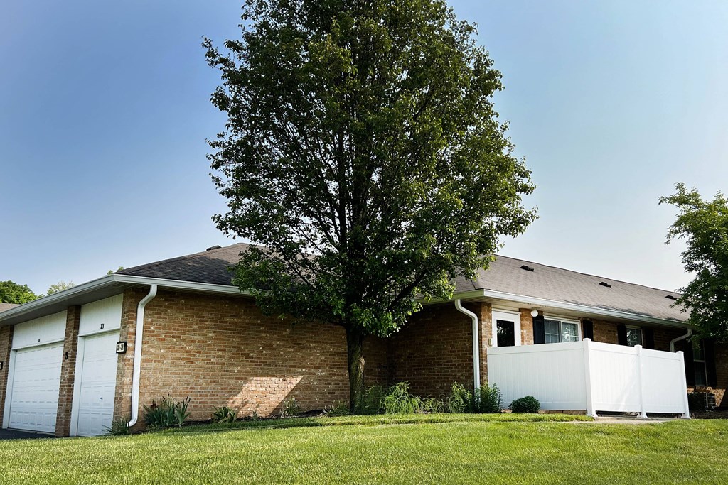 a house with a large tree in front of it  at Wyndemere Apartments, Franklin, 45005