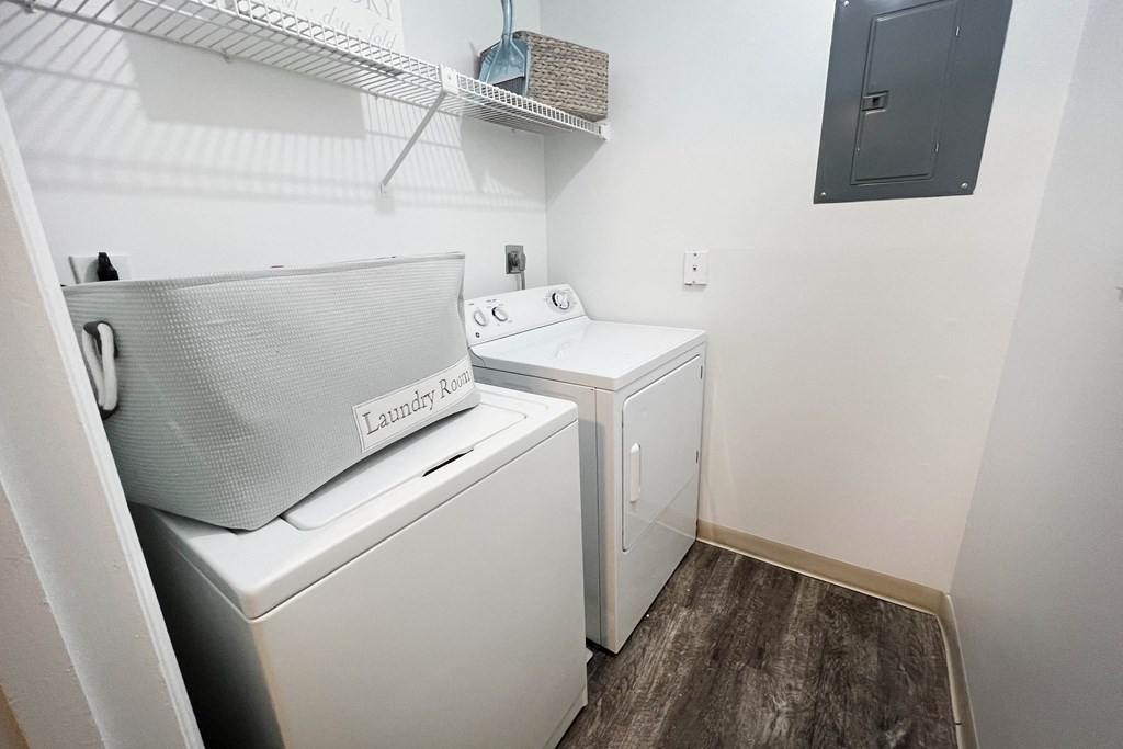 a small laundry room with a washer and dryer  at Steeplechase Apartments, Loveland, 45140
