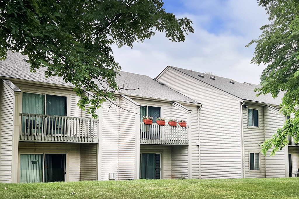 a white building with a gray roof  at Hunter's Creek Apartments, Cincinnati