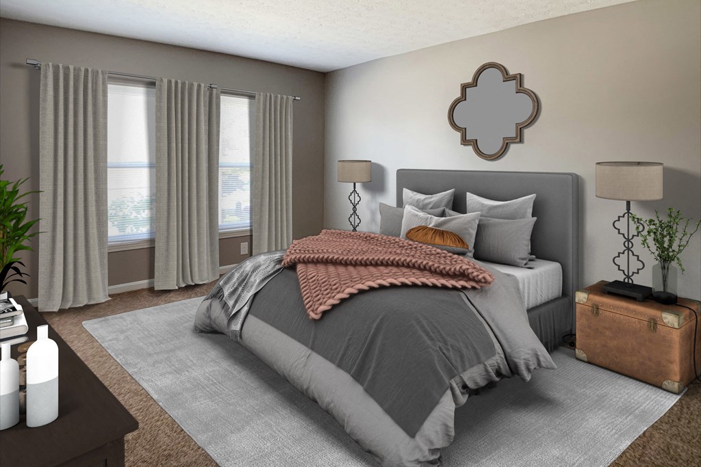 a bedroom with a bed and two windows  at Knobs Pointe Apartments, New Albany, IN, 47150