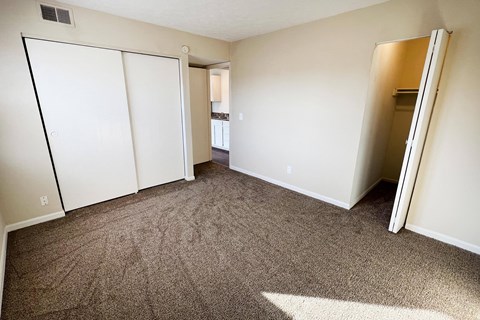 an empty room with carpeting and white walls at Crown Crossing Apartments, Ohio