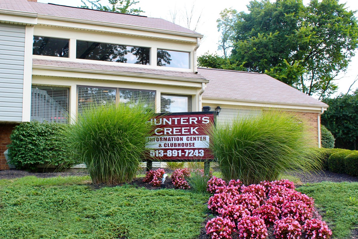 a yard with a sign in front of a house  at Hunter's Creek Apartments, Cincinnati, 45242