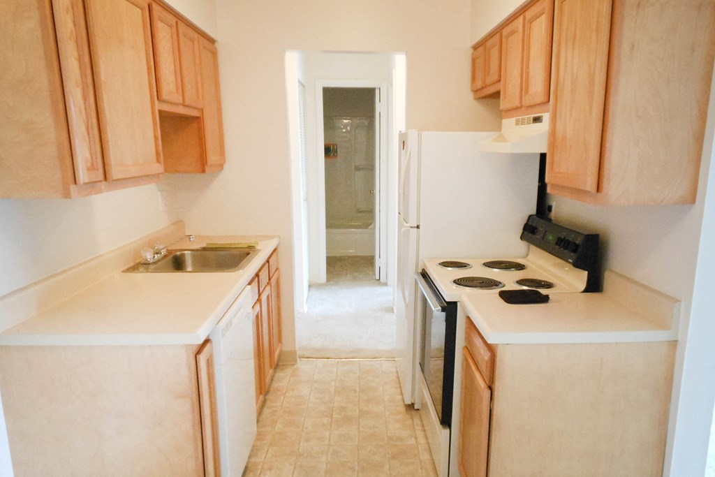 White cabinets in kitchen spaceat Crown Pointe Apartments, Covington, Kentucky