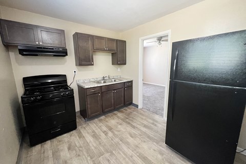 Kitchen With Black Appliances at Crown Court Apartments, Kentucky