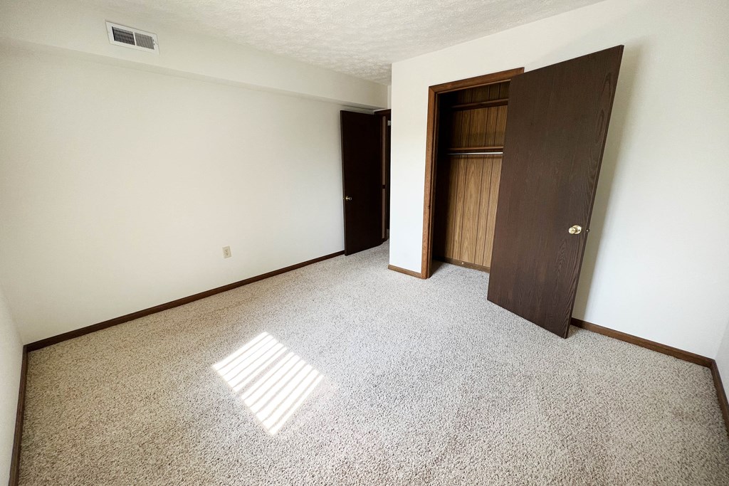 Carpeted Bedroom  at Crestbrook Apartments & Townhomes, Crescent Spring, Kentucky