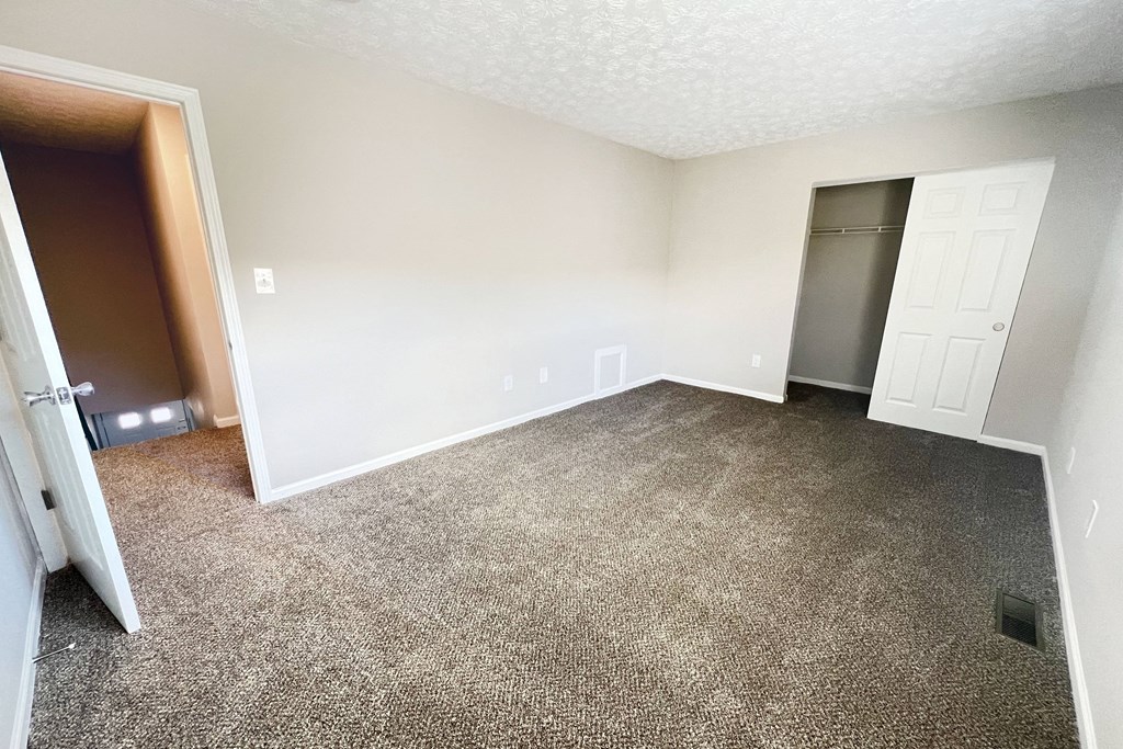 Carpeted Bedroom  at Revere Village Apartments, Centerville, Ohio