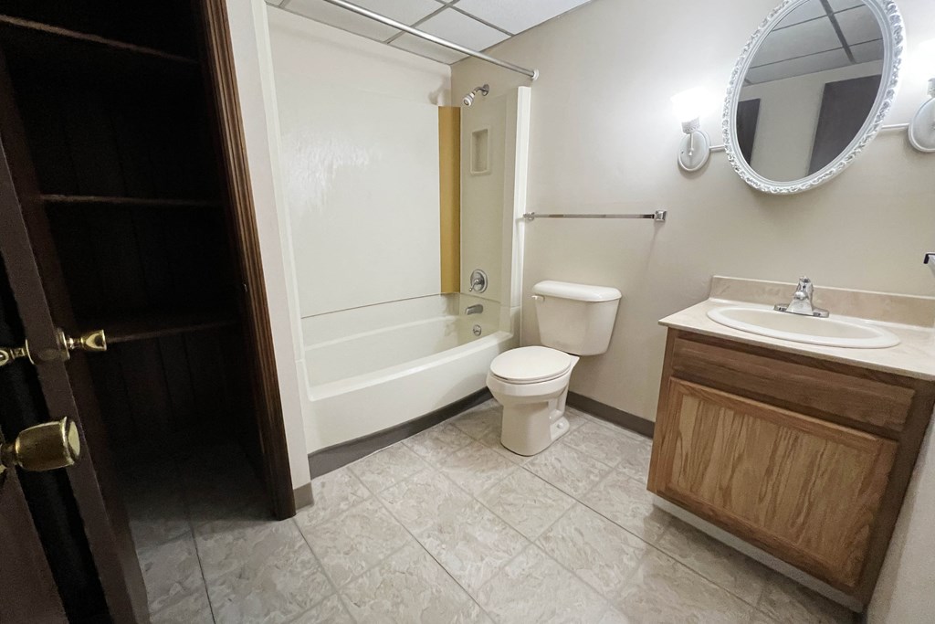 a bathroom with a toilet and a sink and a bath tub  at Grace Court, Ft. Mitchell, KY