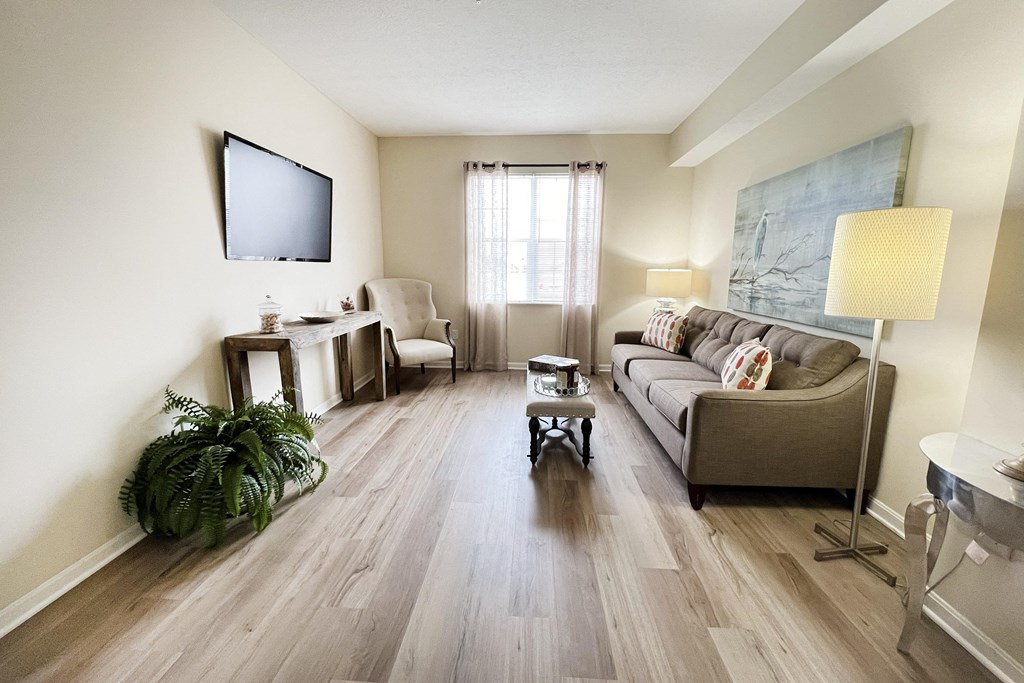 a living room with a couch and a tv at Residences at Northgate Crossing, Ohio, 43235