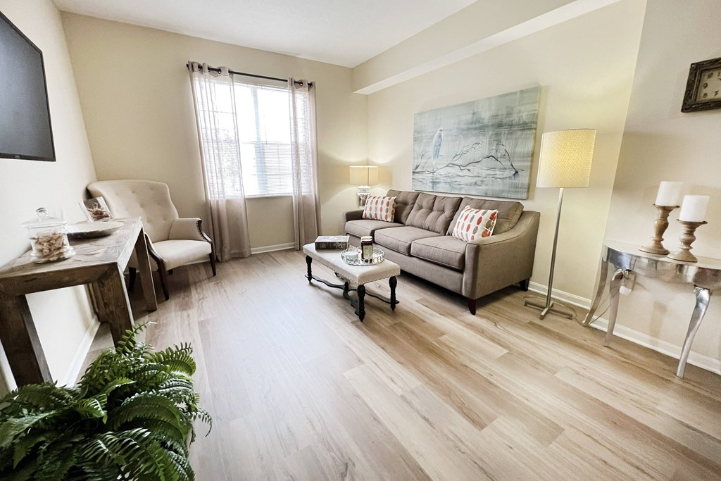 a living room with a couch and a table at Residences at Northgate Crossing, Ohio, 43235