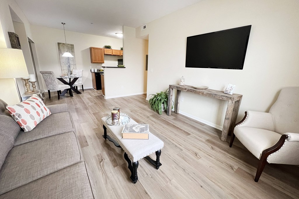 a living room with a couch and a table and a television at Residences at Northgate Crossing, Ohio, 43235
