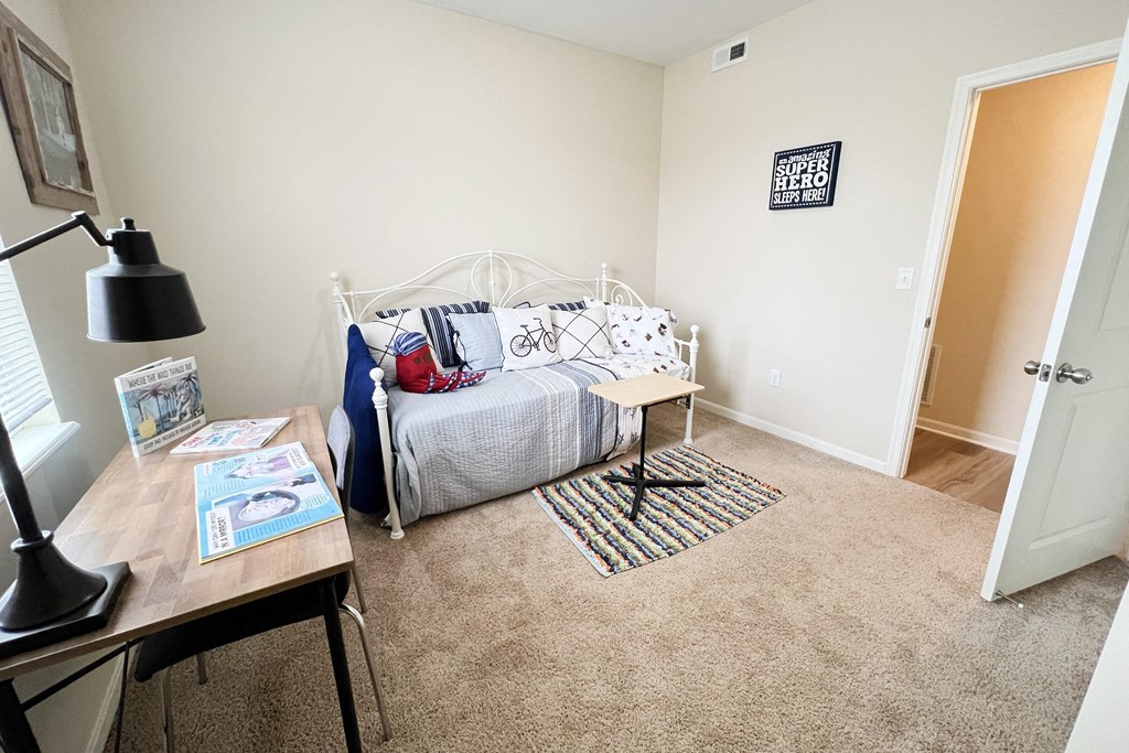 an open bedroom with a bed and a desk at Residences at Northgate Crossing, Ohio, 43235