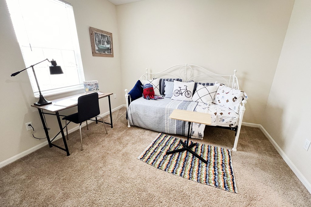 a bedroom with a bed and a desk and a window at Residences at Northgate Crossing, Ohio, 43235