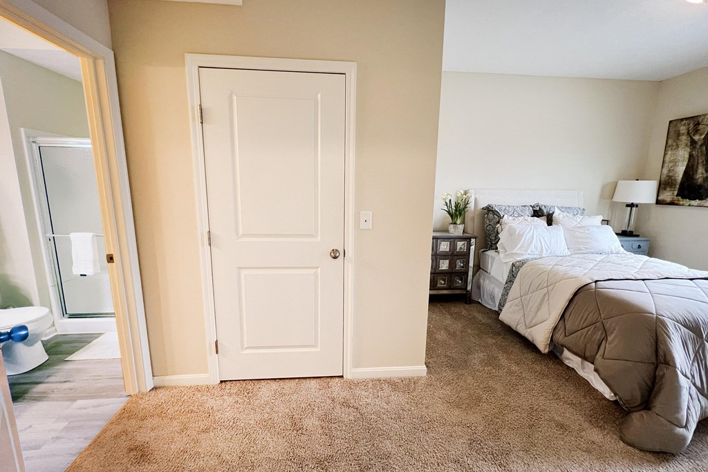 a bedroom with a bed and a closet at Residences at Northgate Crossing, Ohio, 43235